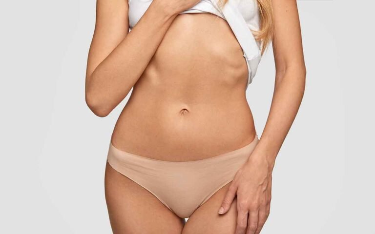 Pourquoi le ventre reste t il gonflé après une liposuccion au début