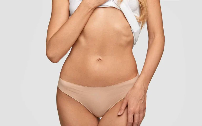 Pourquoi le ventre reste t il gonflé après une liposuccion au début